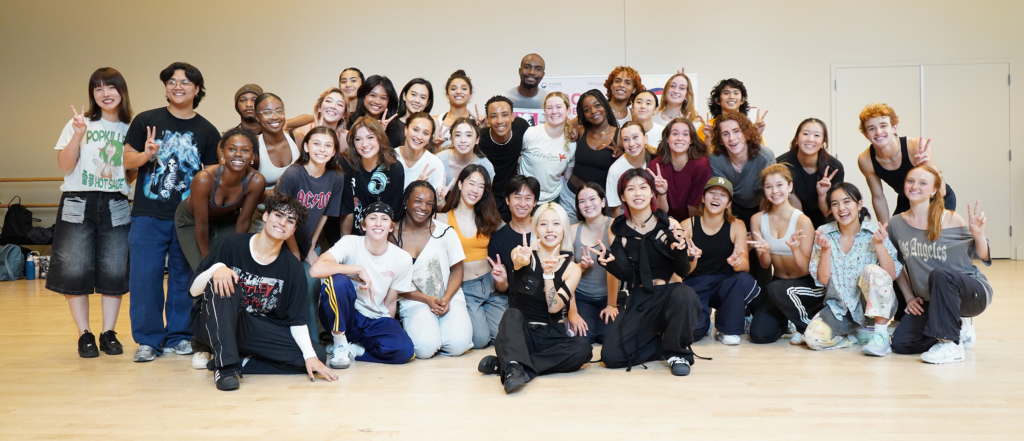 Aiki (center right, in black) and her dance assistant, Odd (at Aiki’s right), take a break with the USC Kaufman students. (Photo/Valerie Chen)