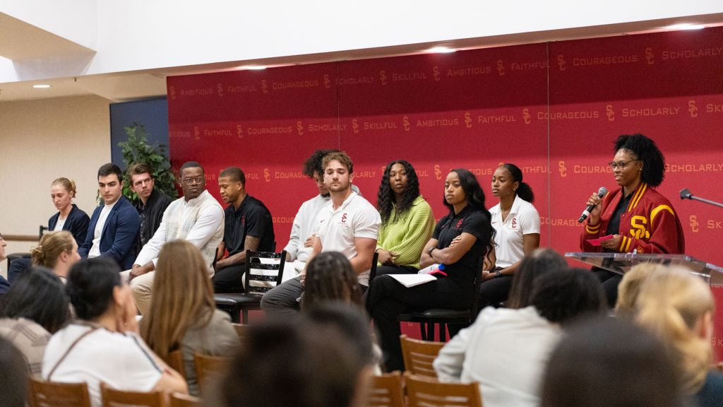 Summer Mosley, on stage with other student-athlete panelists, describes her experience. (USC Photo/Drake Lee)