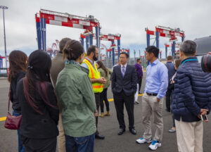 During a tour of the Port of Long Beach, students speak with key officials