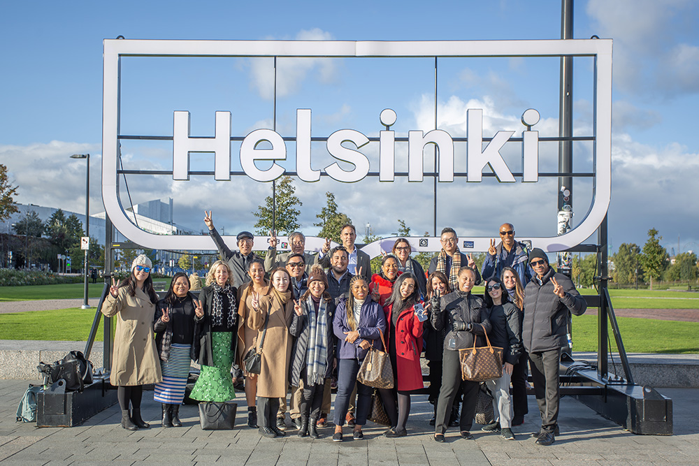 Group of Global Executive EdD participants from USC Rossier School of Education at Helsinki sign during an international educational visit.