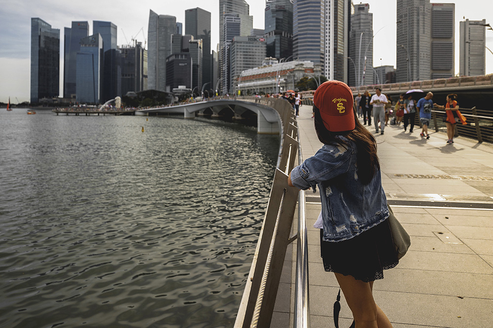 USC student Allison Taslim overlooking the skyline in Singapore during the Fall 2016 semester, highlighting USC's global presence and partnerships.